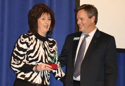 Johnny Adams (right) presents 'Citizen of the Year' award to Shawn Johnston.