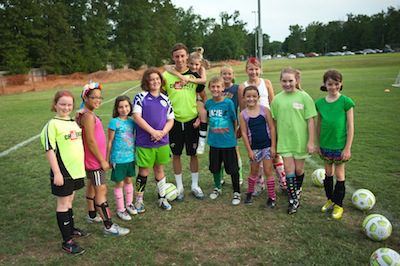 Abby Moore (from left), Nyah Peyton, Haley Hankins, Kaitlyn Witherell, Coach Ashley Walker, Hope Shrell, Reagan Kohler, Logan Wilson, McKensie Muse, Ainsley Nasello, Ashley Roberts and Kate Barnes. (Todd Owens photo)