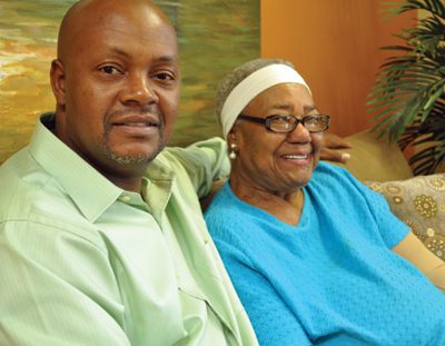 Sam McDaniel (left) feels better knowing his mother, Rosie McDaniel (right), attends the Senior Day Care at St. Vincent Morrilton for socialization and health care.