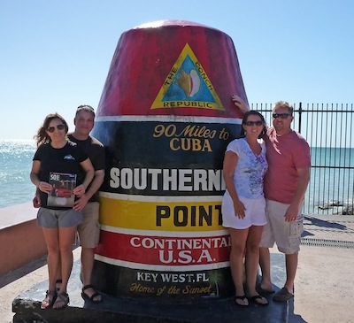 Jill and Cory Imboden (left) and Christy and Paul Hudson at the Southern Most Point in the continental U.S. at Key West following a scuba dive on the USS Vandenburg artificial reef. The couples were in Florida for a prayer breakfast speaking engagement in Orlando.