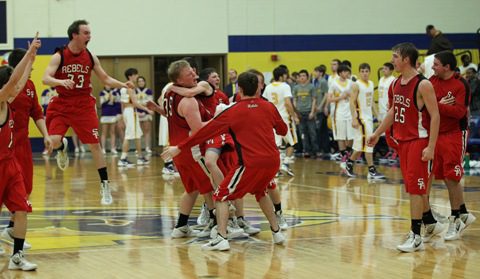 The Sacred Heart Rebels celebrate a berth to the state championship game. (Carolyn Leinhart photo.)