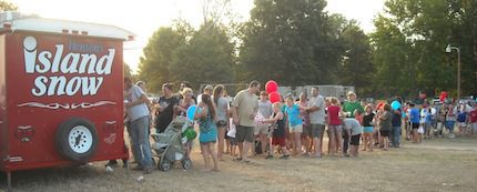 Jim Henson and his wife donated and served snow cones. (Randy Durdin photo)