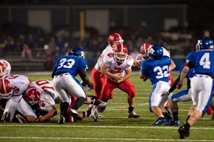 Ian Thompson fights for extra yardage against Bryant. (Todd Owens photo)