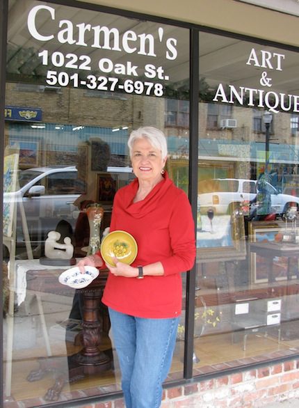 Patricia Thessing holds two bowls donated by Carmen's Antiques.