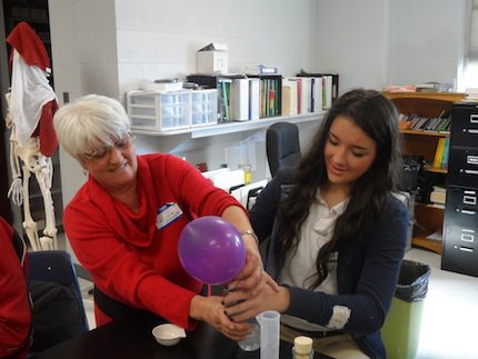 High school student Chloe Andrews works in the lab with her grandmother.