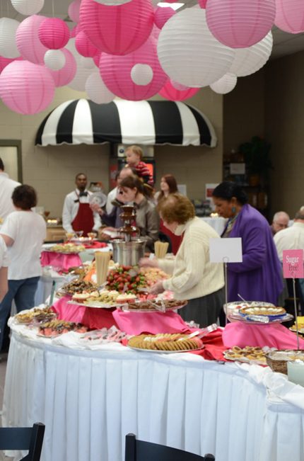 Attendees peruse the desserts at the UACCM fundraiser.