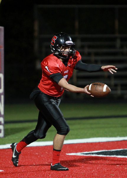 Qualls punts the ball for the Searcy Lions. (Diana Cantey photo)