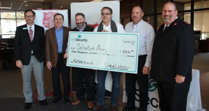 Johnny Adams (from left) with Salvation Army board members Steve Jessen, Bret Carroll, J.R. Runyon, Greg Lamb and Salvation Army Major David Robinson.