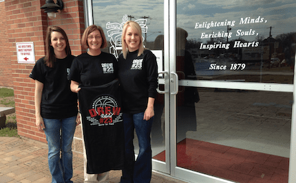 Abby, Patti and Michelle with the T-shirt created in memory of Drew.