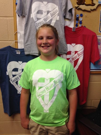 Sacred Heart sixth-grader Halen Hoelzeman designed this year’s Bazaar T-shirt. Shirts are available for sale and order forms can be found on the bazaar page of the school website at sacredheartmorrilton.org.