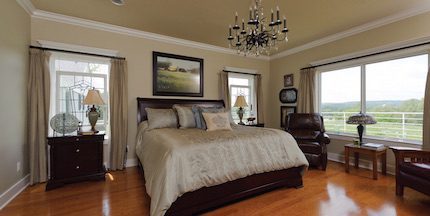 In the master bedroom, Harold does an excellent job bringing together the old with the new. All the windows throughout the house give you breathtaking views of the surrounding beauty of the farm.