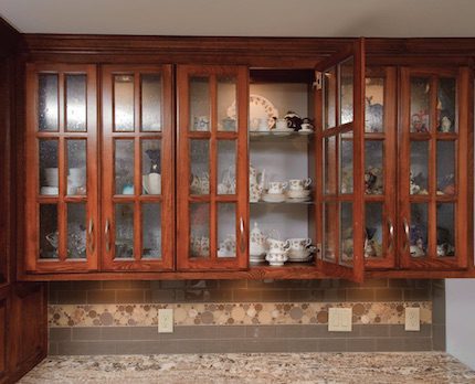 Before, Sandra’s glass cabinets had to share space with the microwave and cookbooks. Now, with wasted space utilized, her cookbooks and microwave have a place of their own, and her collections can be appreciated.