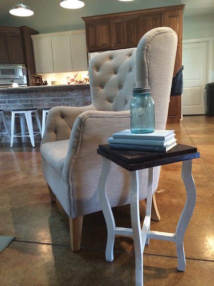 Paint and stain transformed a $2 garage sale table into a decorative piece.