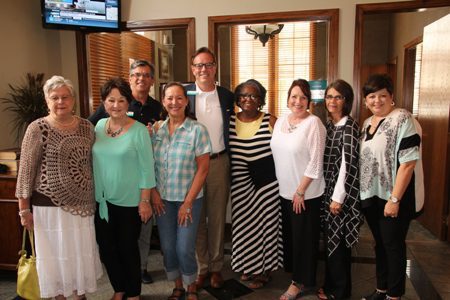 Friends who worked with Denice Perry (second from left) at First National Bank: Martha Wilcox (from left), Denice, George Baker, Debbie Ferguson, Johnny Adams, Verna Hervey, Sandra Hayes, Kim Reeves and Lisa Hegeman. Denice also worked with several at First Security Bank.