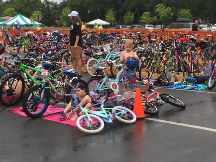 Bikes and athletes fill the transition area during the race.