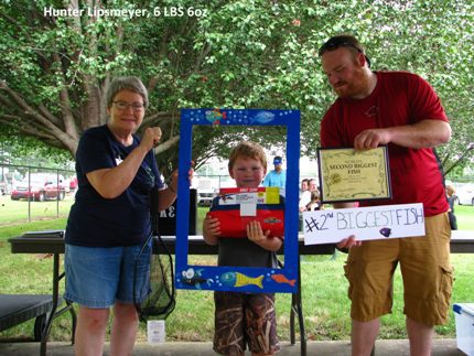 Hunter Lipsmeyer, pictured with Lorlie March  (left) and  Will Lipsmeyer,  won second place with the second biggest fish.