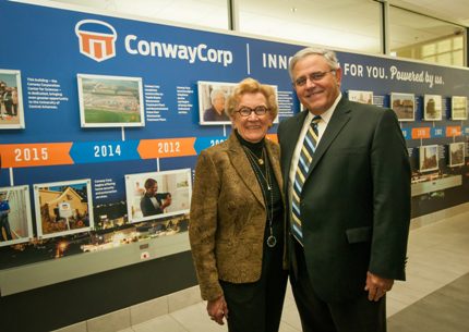 Dr. Sue Griffin and Richie Arnold, chief executive officer of Conway Corporation, view the lobby display in the Conway Corporation Center for Sciences, which was made possible in part by gifts from Griffin and Conway Corporation.