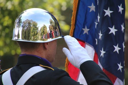 A member of the University of Central Arkansas ROTC Color Guard posts the America flag during the Veterans Day celebration on campus.