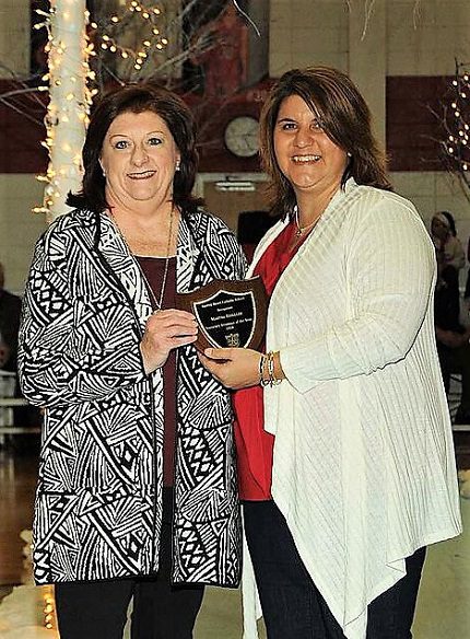 Booster Club president Djuana Beck recognized Martha Briggler as this year’s Honorary Alumnus of the Year.