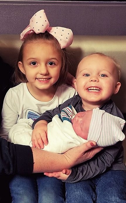 Big sister, Olivia Harper, and Oliver Blake with their new baby brother, Lloyd.