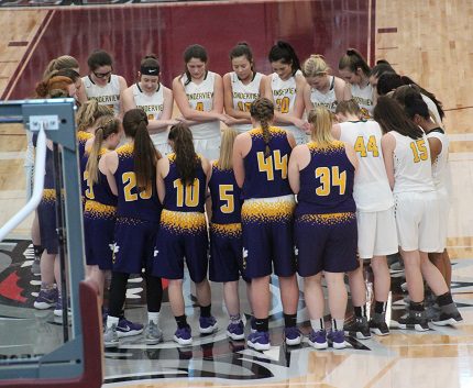 Wonderview and Bay players gathered at center court after the game to pray together. (Sonja Keith photo)