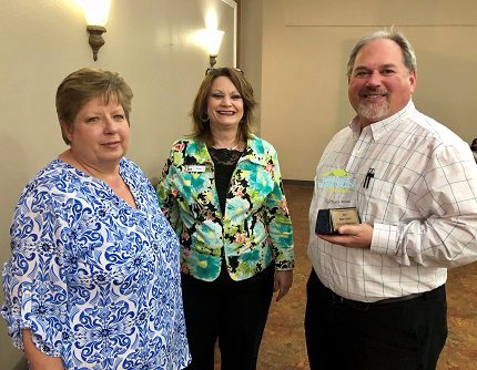 Cheri Hill (from left), Tri-Peaks board member Kim Hightower and Perryville City Council member Brian Hill accepting the award on behalf of the City of Perryville.